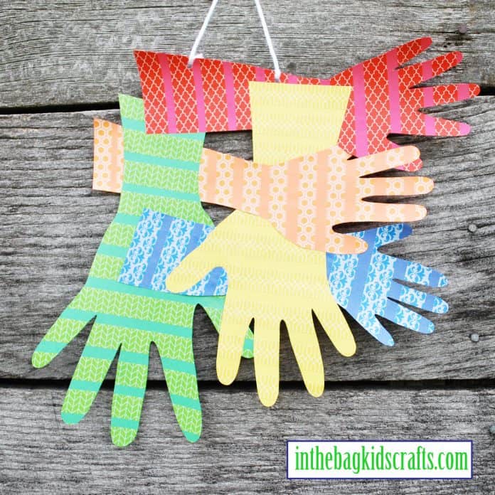 Handprint Wall Hanging Featured Image family handprints wall hanging easy kids' craft with construction paper and washi tape